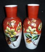 A pair of French Glass Baluster Vases, painted in colours with stylised foliage on a treacle reserve