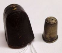 A base metal Thimble contained within a silk and velvet-lined morocco covered case