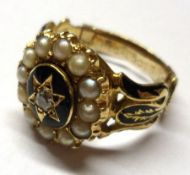 An unmarked Victorian Gold Mourning Ring, featuring a small old cut Diamond to the centre within a