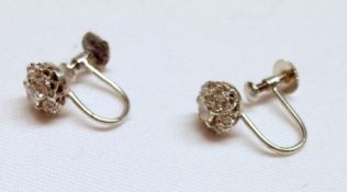 A pair of precious metal all brilliant cut Diamond set Cluster Earrings (screw type), the centre