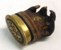 A Brass Mounted Canister, fashioned from a reptile claw, width 2 ½”