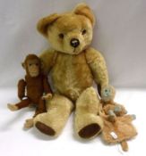 A mid-20th Century Blonde Mohair Teddy Bear with black felt nose, stitched mouth detail, amber glass