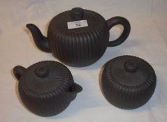 An Oriental Pottery Tea Service of ribbed form, comprises Teapot, Lidded Cream Jug and similar