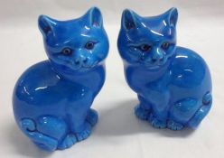 A pair of Blue Glaze Models of seated Cats, 5” high