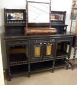 A Victorian Aesthetic Period Sideboard, bevelled glass mirror back over a short gallery with an open