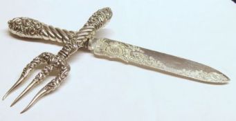 A late Victorian Silver Handled and Electroplated Bread Knife and Fork, the hollow cast and