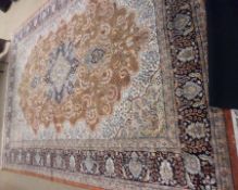 A Caucasian style Carpet, multi-gull border, central panel of twining foliage, mainly rust, beige