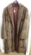 A Vintage Ladies Mid-Brown Squirrel Locke Coat retailed by Griffin & Spalding Furriers of Nottingham