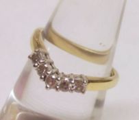 A hallmarked 18ct Gold five small brilliant cut Diamond set Wishbone design Ring