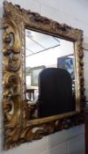 A heavy Gilt and Gesso large Picture Frame, heavily moulded with foliate scrolls, and now inset with