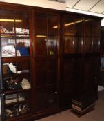 A pair of 20th Century Mahogany Bookcases with glazed upper and lower sections, each enclosing