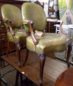 A pair of Green Leather Upholstered Mahogany Framed Carver Chairs, with slayed moulded arm rests