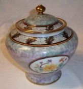 A Noritake Circular Covered Large Jar, decorated with panels of foliage on an iridescent ground,