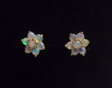 A pair of yellow metal small all Opal set flower-head design Earrings