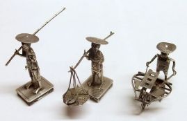 A Mixed Lot comprising: three various Models depicting Oriental Figures, one with a barrow, the
