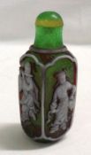 An Oriental Glass Snuff Bottle, each side decorated with figures, 3 ¾” high