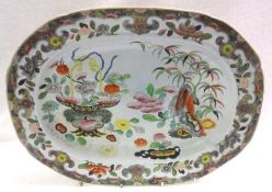 A large Ironstone Turkey Plate, decorated in colours with an Oriental floral design and inset with