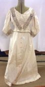 An early 20th Century Ivory Cream Full Length Skirt, with matching Bodice, embroidered edge detail