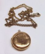 An early 20th Century hallmarked 9ct Gold Circular Locket, engraved with initials “GHM” in