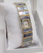 A gilt metal and mother-of-pearl mounted Ladies Cocktail Watch, with white stone mount, original