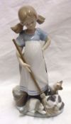 A Lladro Model of a young girl with a mop and bucket and playful kittens, 8 ½” high