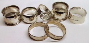 A Mixed Lot comprising: three various hallmarked Napkin Rings, each of cylindrical form; together
