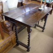 A 17th Century and later Oak Rectangular Fold Top Gateleg Table, raised on twisted supports,