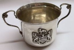 A late Victorian two-handled Mug, of polished circular form with flared rim, cast and applied floral