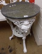 A White Painted Cast Metal Pub Table, of circular form, embossed with masks and scrolls etc and with