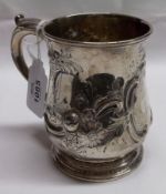 A George II Tankard, of baluster form with hollow cast and applied acanthus leaf capped “C” scroll