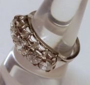 An unmarked precious metal five graduated brilliant cut Diamond Ring, approximately 1.2ct total