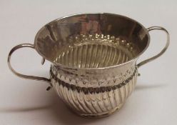 A Queen Anne Miniature Porringer, of flared circular form with punched border and half-wrythen