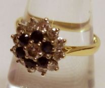 A hallmarked 18ct Gold all small Diamond/Sapphire set Cluster Ring of flower-head design