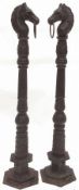 A pair of Heavy Cast Metal Black Painted Freestanding Hitching Posts, of column form with horse’s