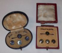 An early 20th Century cased set of three Green Enamel Buttons with gilt rims and mounts; together
