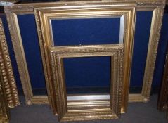 GROUP OF FOUR LATE 19TH/EARLY 20TH CENTURY GILT GESSO PICTURE FRAMES, the largest 29” x 39”