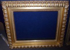 HEAVY AND FLUTED CARVED GILTWOOD PICTURE FRAME, 19” x 26”