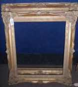 TWO VICTORIAN STYLED GILT GESSO SWEPT PICTURE FRAMES, 15” x 13” and 17” x 15” (2)