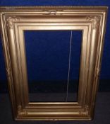 LATE 19TH/EARLY 20TH CENTURY GILT GESSO SWEPT PICTURE FRAME WITH ACANTHUS CORNERS, 14 ½” x 10”