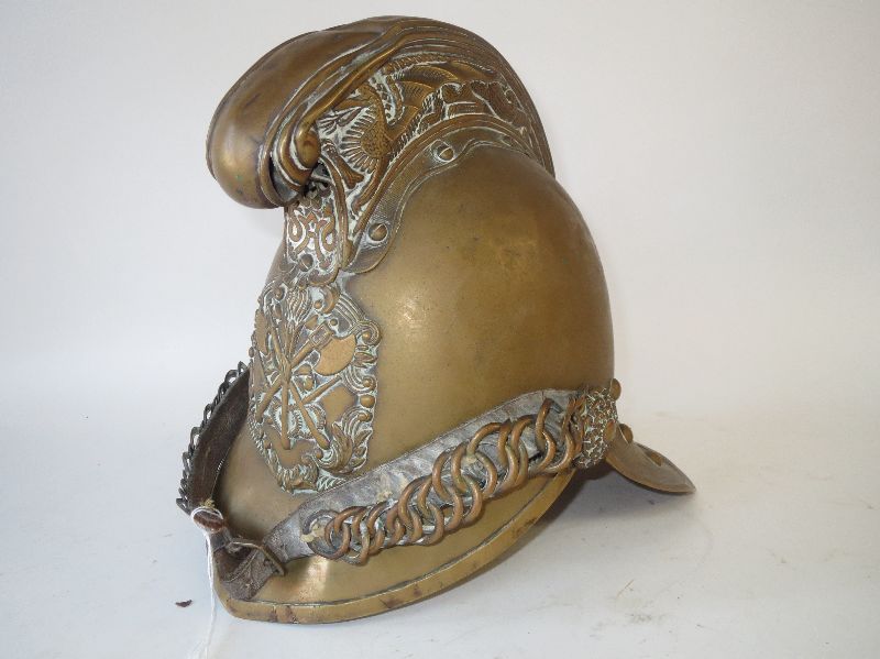 Antique brass fireman`s helmet by Merryweather & Sons Fireman`s Outfitters London