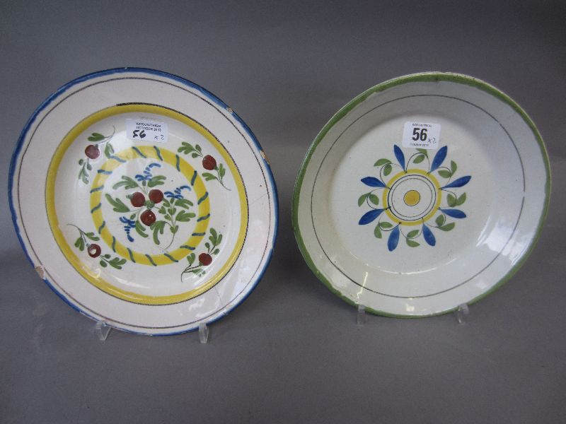 Two continental faience saucer dish one floral central spray & double yellow band the other deep