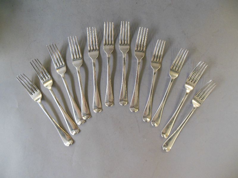 Set of twelve George III O.E.P. table forks London 1806. Maker’s Mark: T.B. Weight 24ozs