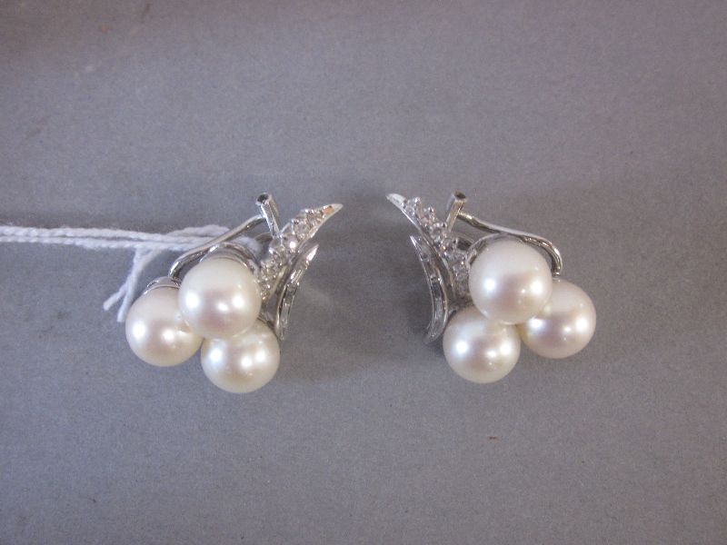 Pair of three pearl & diamond 18ct white gold clip earrings