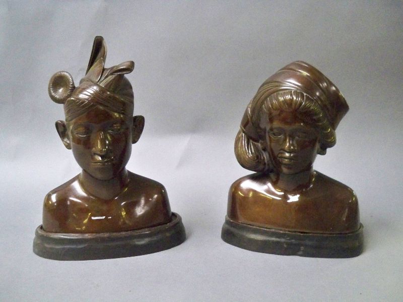 Pair of east Asian bronze cast busts of male & female islanders