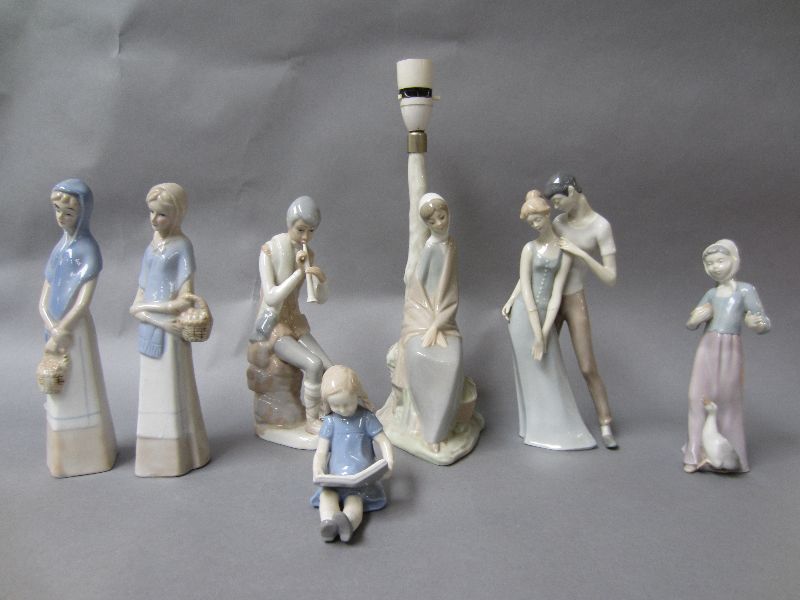 Lladro Nao lampbase as a seated female figure plus six similar figure groups (7)