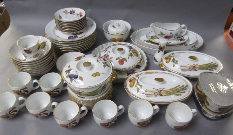 Royal Worcester `Evesham` pattern part dinner service to include oval tureens, round tureens, flan