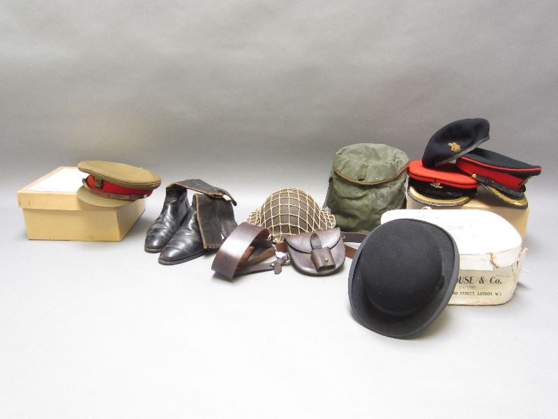 Four military hats, tin hat, black bowler hat & black military boots, Sam Browne & gas mask