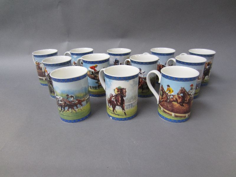 Set of 12 Warbury Mint `Racing Legends` coffee mugs, riders colours inside