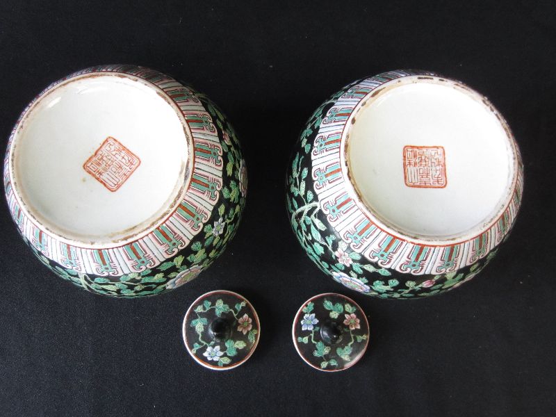 Pair of Chinese porcelain famille rose ovoid vases and covers with stylised bird foliate