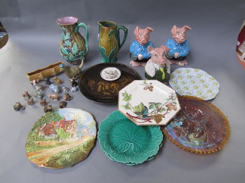 Assortment of ceramics to include three Wade Nat West piggy banks, two majolica jugs, plates, Wade